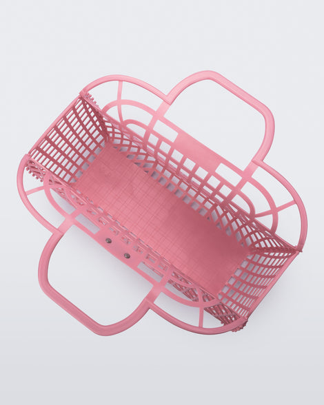 Top view of a pink Refraction bag with handles