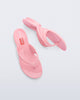 Top and side view of a pair of pink Flip Flop + Diesel sandals