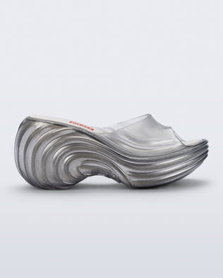 Side view of a clear silver Quantum Silver sandals