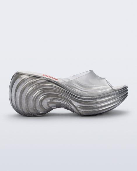 Side view of a clear silver Quantum Silver sandals
