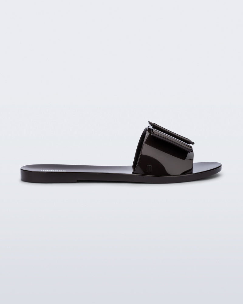 Side view of a brown Babe slide sandal