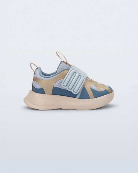 Side view of a blue X Beat baby sneaker with beige trim
