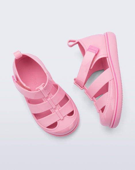 Top and side view of a pair of pink Smash closed toe baby sandals