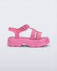 Side view of a pink Ella kids sandal with heel strap