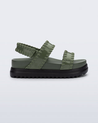 Side view of a green Dune Platform Sandal with faux stitching on the straps and black sole