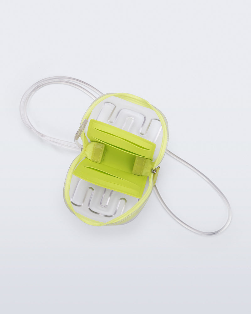 Top view of a clear Jelly Wallet with green inside pocket and zipper