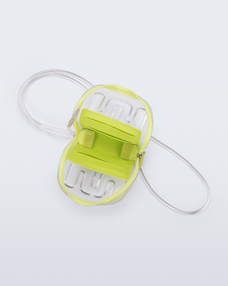 Top view of a clear Jelly Wallet with green inside pocket and zipper