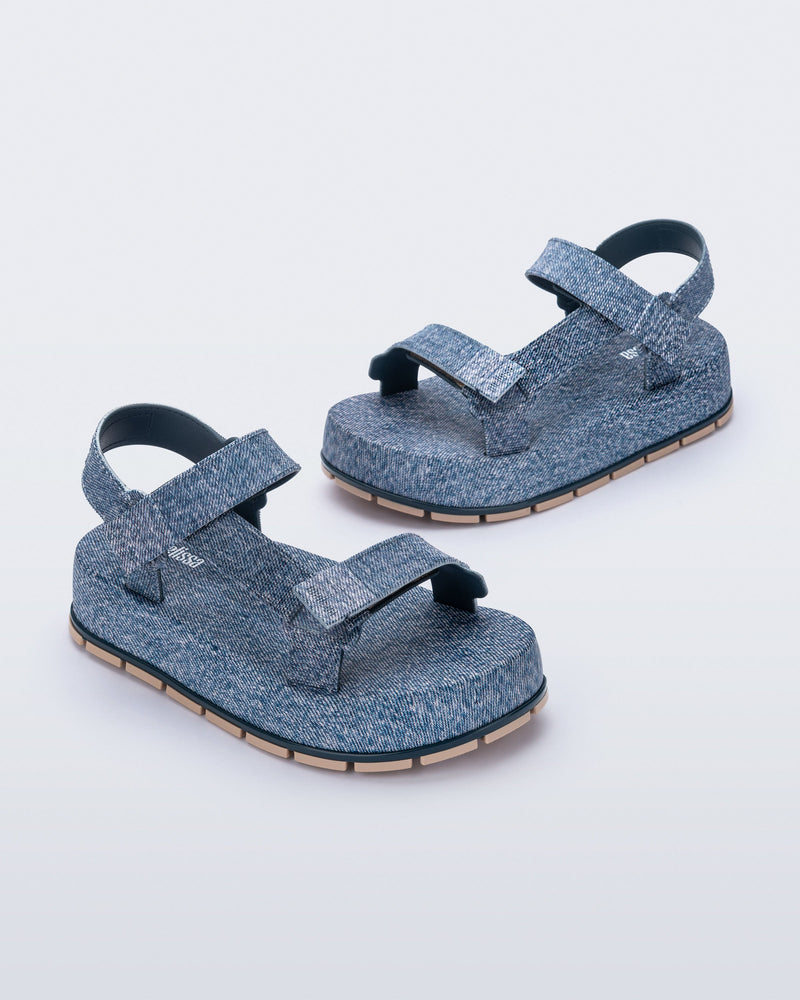 Angled view of a pair of blue jean Flowing Denim platforms