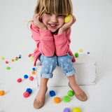 kid wearing the gold campana flats