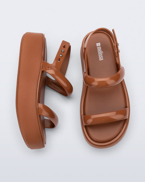 Top and side view of a pair of brown Wave Platform sandals with top and heel straps