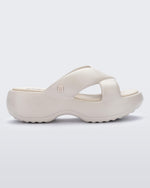 Side view of a beige Free Rise platform slide sandal