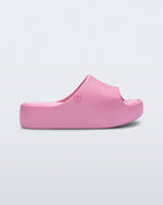 Side view of a pink Free Platform Slide kids sandal