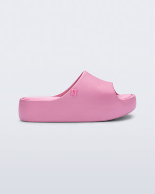 Side view of a pink Free Platform Slide kids sandal
