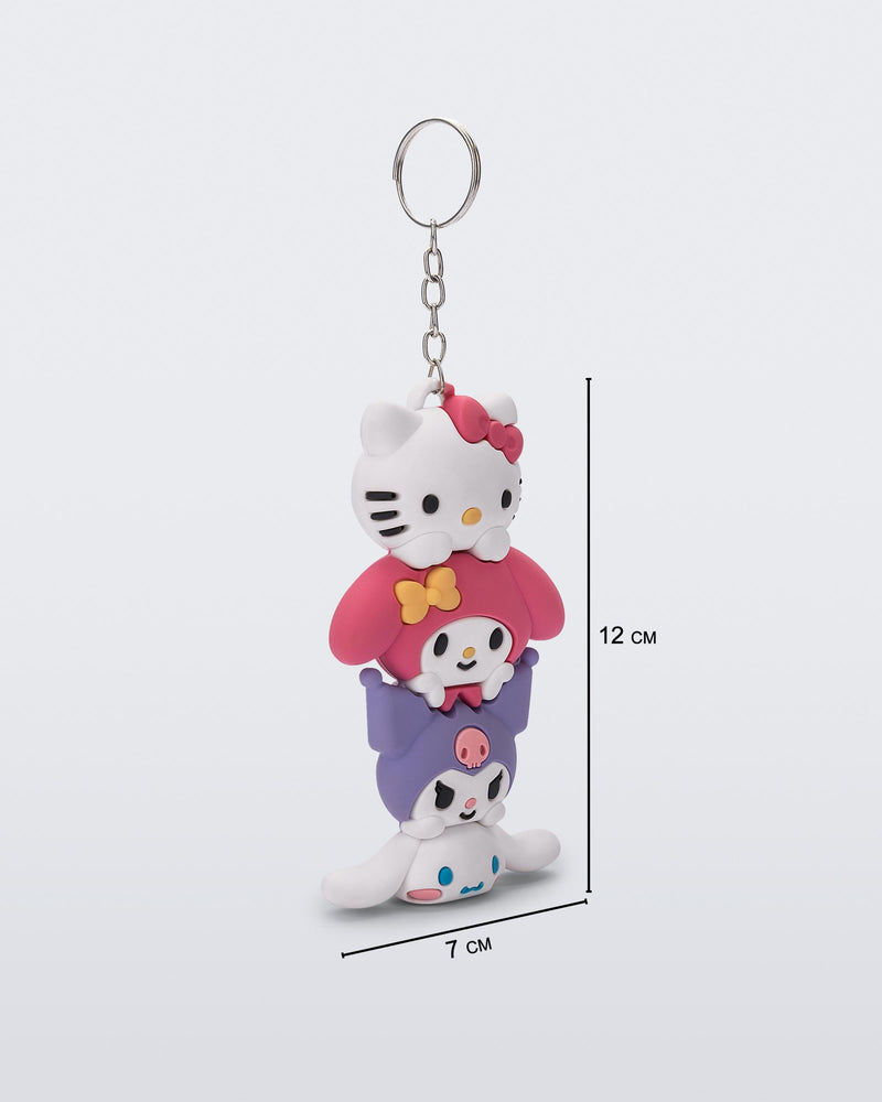 Angled view of a Hello Kitty + Friends charm keychain with Hello Kitty and two friends with measurements 7cm X  12 cm