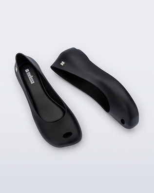 Side and top view of a pair of black Ultragirl Futura ballerina flats