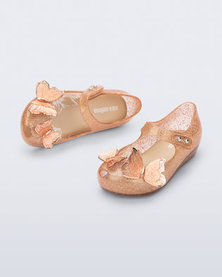 Top and angled view of beige glitter Ultragirl Butterfly baby flats with butterflies on top