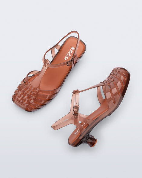 Top and side view of a pair of clear brown Vixen Kitten Heel sandals