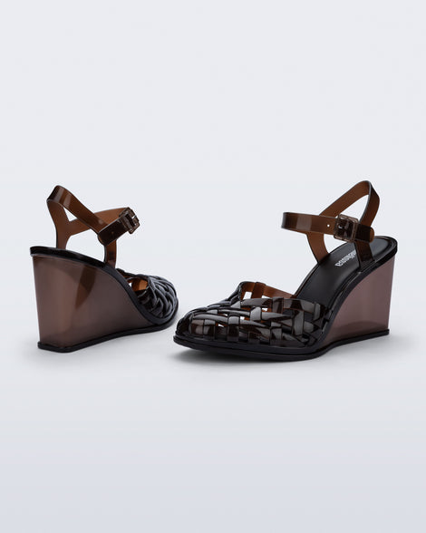 Side and back angled view of a pair of clear brown Agata wedge heel sandals with ankle strap