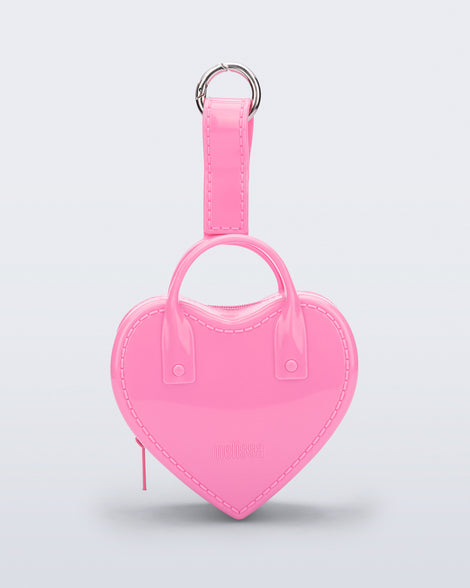 Front view of a pink Heartbeat Pocket bag charm