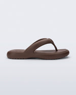 Side view of a bronze Free Low flip flop