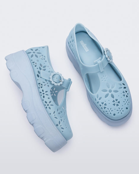 Side and top view of a pair of blue Kick Off Lace women's platform shoe with buckle.