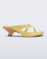 Side view of a yellow Layla kitten heel flip flop
