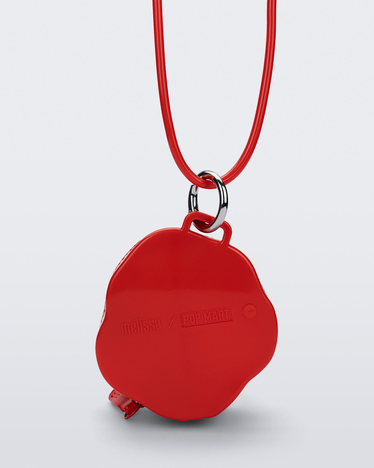 Bag view of a red Bag + Pop Mart Pucky small bag with short strap