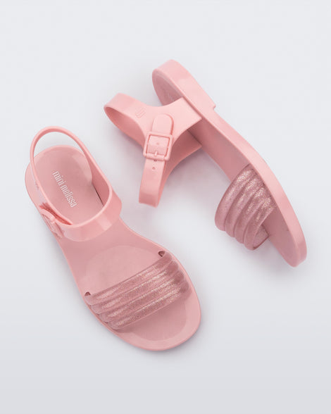 Side and top view of a pair of pink Mar Wave kids sandals.