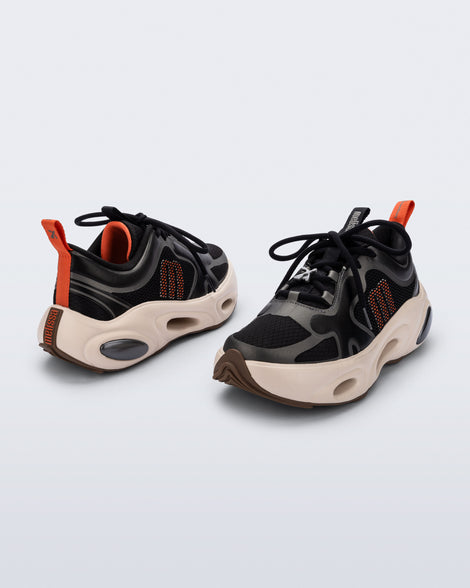 Back and angled view of a pair of black X Loop sneakers with beige soles