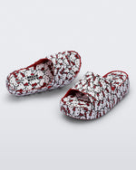 Top and angled view of a pair of red Hello Kitty + Friends Free Platform with Hello Kitty print