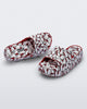 Top and angled view of a pair of red Hello Kitty + Friends Free Platform with Hello Kitty print