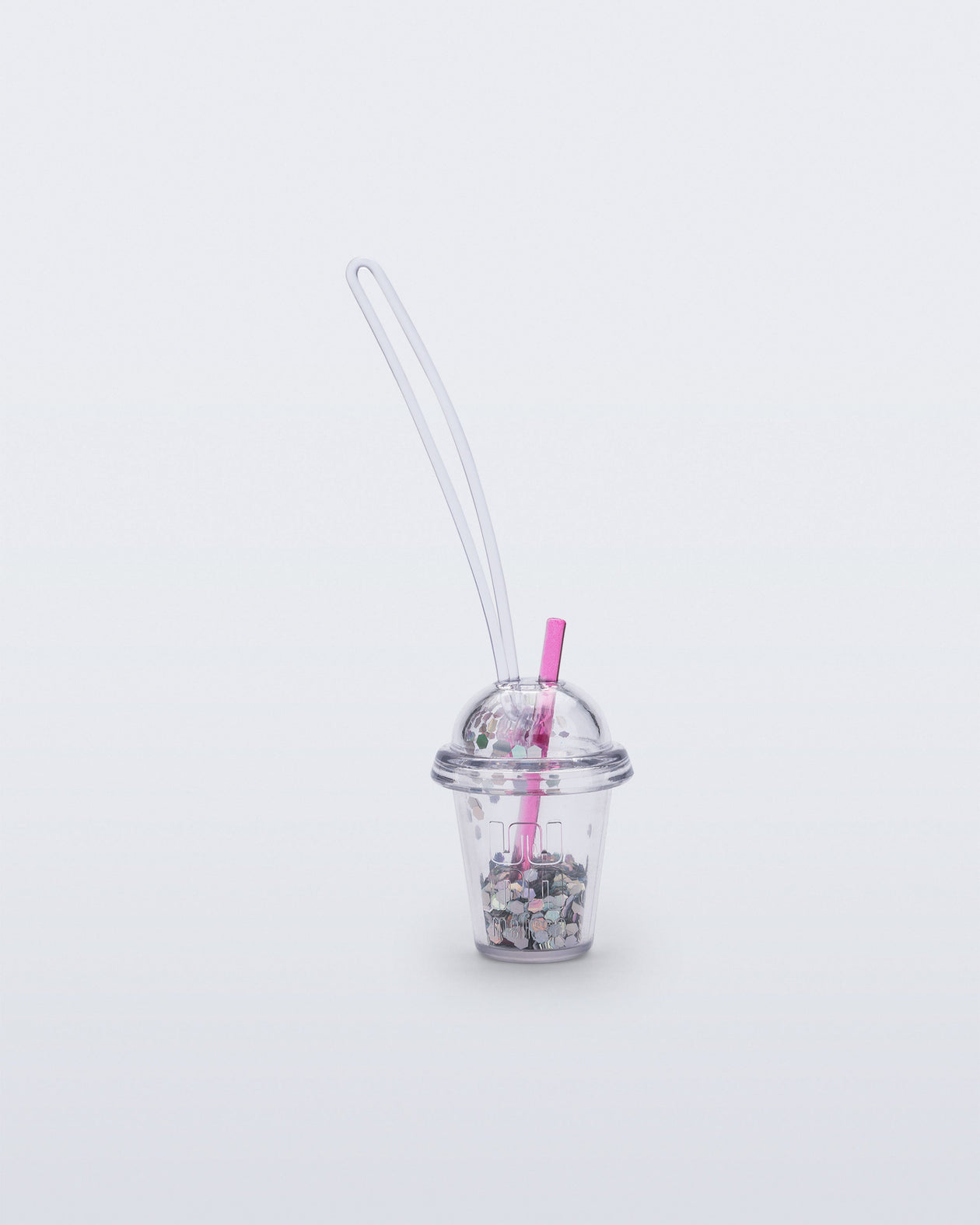 Front view of a clear drink charm with pink straw