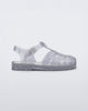 Side view of a glitter/clear/silver Possession kids fisherman sandal