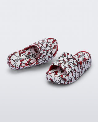 Top and angled view of a pair of red Free Platform slides + Hello Kitty and Friends kids sandals with Hello Kitty print