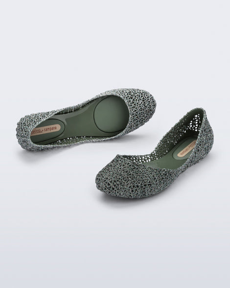 Top and side angled view of a pair of green glitter Campana flats