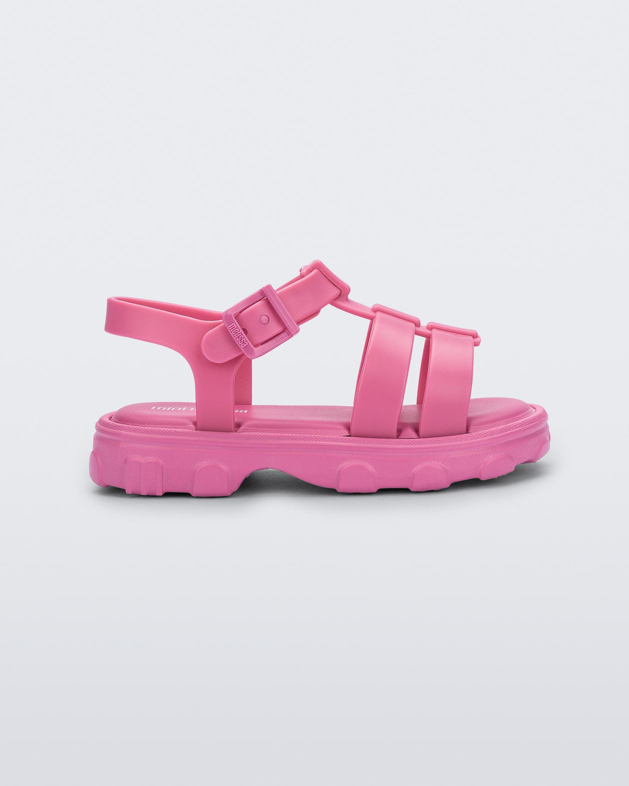 Side view of a pink Ella baby sandal with ankle strap
