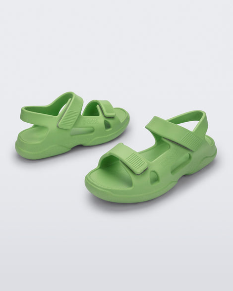 Angled view of a pair of green Free Papete sandals