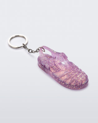 Angled view of glitter lilac Possession keyring