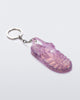 Angled view of glitter lilac Possession keyring