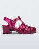 Side view of a glitter pink Possession heel sandal