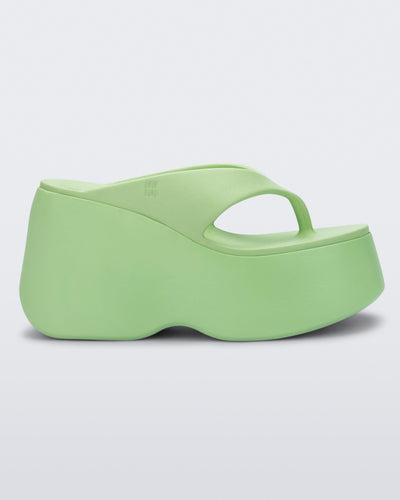 Side view of a green Free Thong Wedge Platform heel