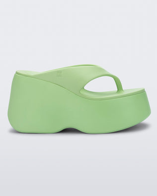 Side view of a green Free Thong Wedge Platform heel