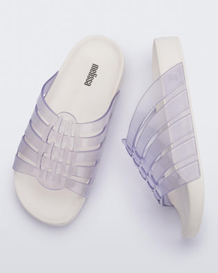 Top and side view of a pair of clear Possession Slide with white sole