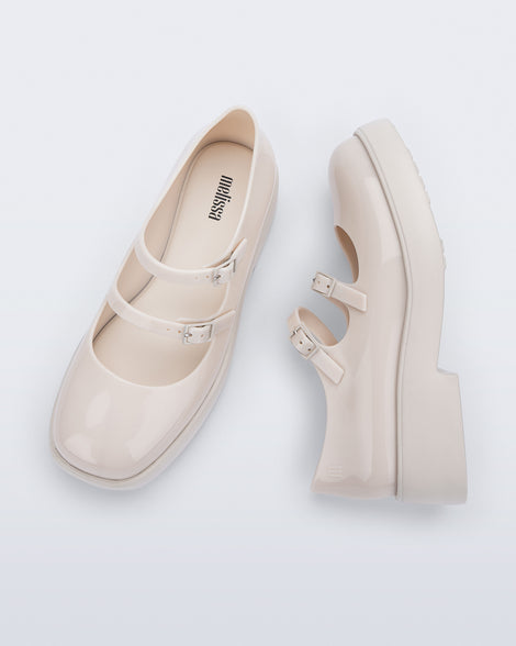 Side and top view of a pair of beige Farah Low Mary jane loafers