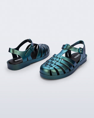 Back and side angled view of a pair of metallic magic green Possession Fisherman sandals
