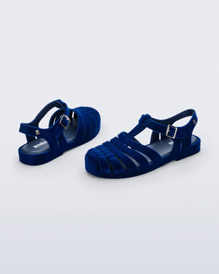 Side and back angled view of a pair of flocked blue Possession Velvet fisherman sandals