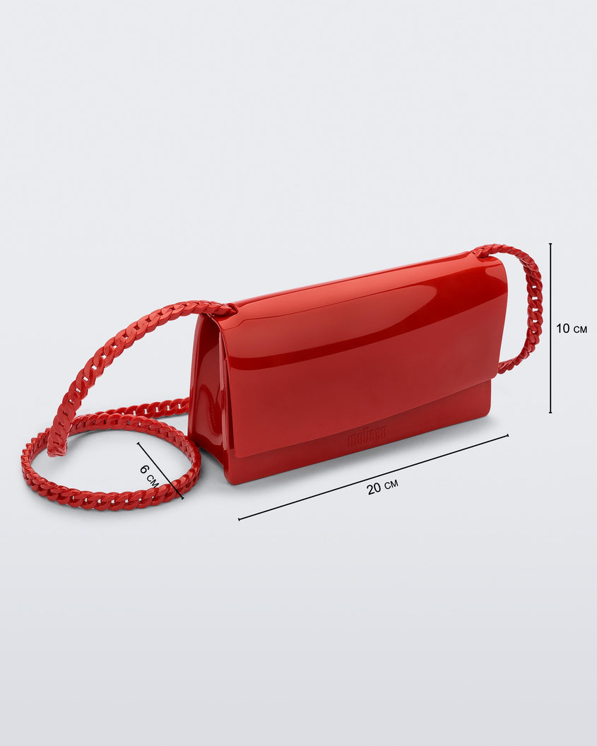 Angled view of the Melissa party handbag in red with measurements of 20 cm width, 10 cm height, 6 cm depth
