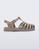Side view of a glitter beige kids Possession fisherman style sandal.
