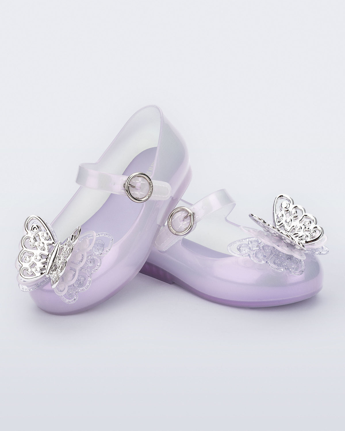 Angled view of a pair of pearly purple Sweet Love Butterfly baby flats