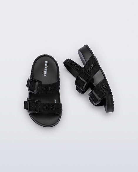 Top and side view of a pair of black Cozy M Lover baby sandals